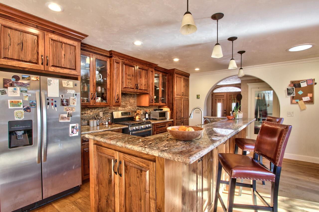 545 Pini Road Watsonville, CA 95076 - Photo 5 of 18 a kitchen with stainless steel appliances granite countertop a stove a sink a refrigerator dining table and chairs