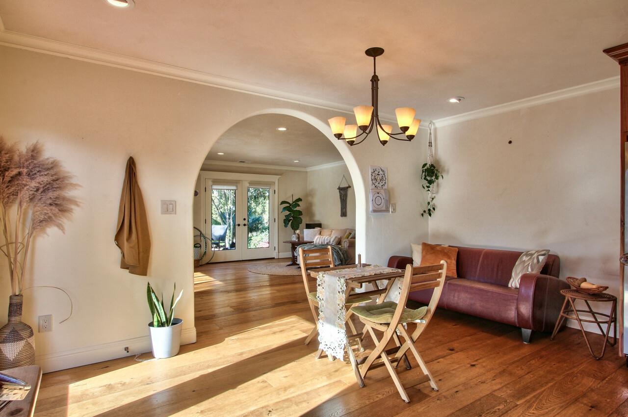 545 Pini Road Watsonville, CA 95076 - Photo 6 of 18 a dining room with furniture a chandelier and wooden floor