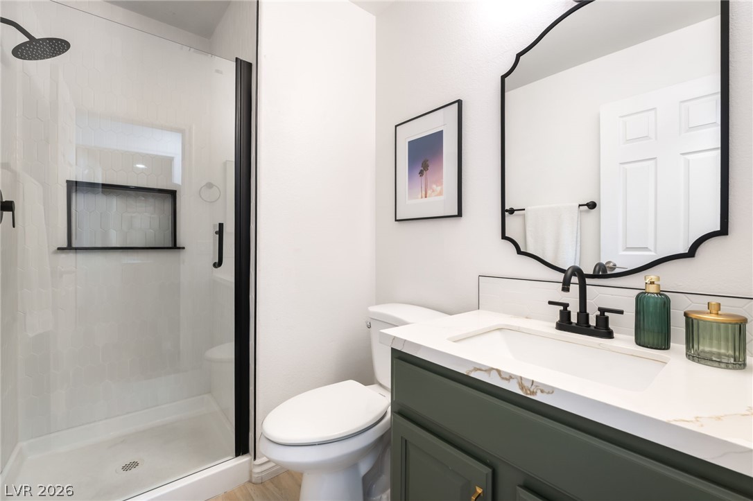 1941 Ivy Point Lane Las Vegas, NV 89134 - Photo 11 of 21 This newly renovated bathroom showcases a contemporary shower with sleek fixtures and a stylish vanity.