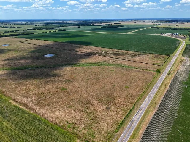 a view of a field with a grassy field