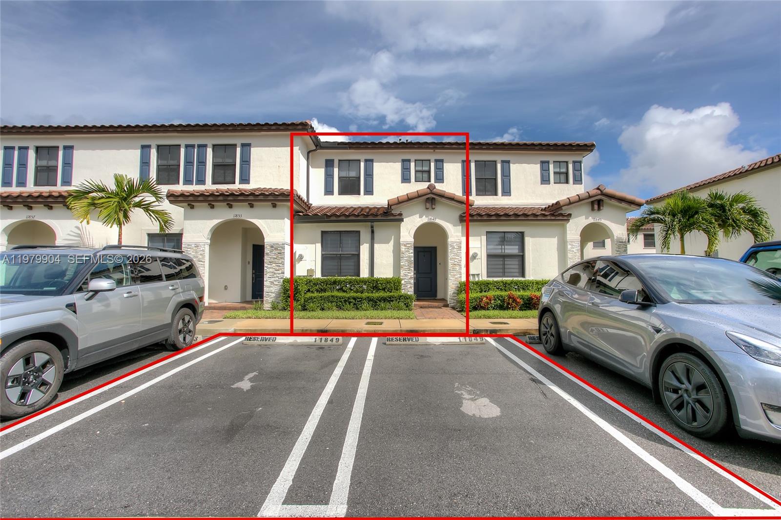 11849 Southwest 247th Terrace Homestead, FL 33032 - Photo 1 of 13 a front view of a house with parking space