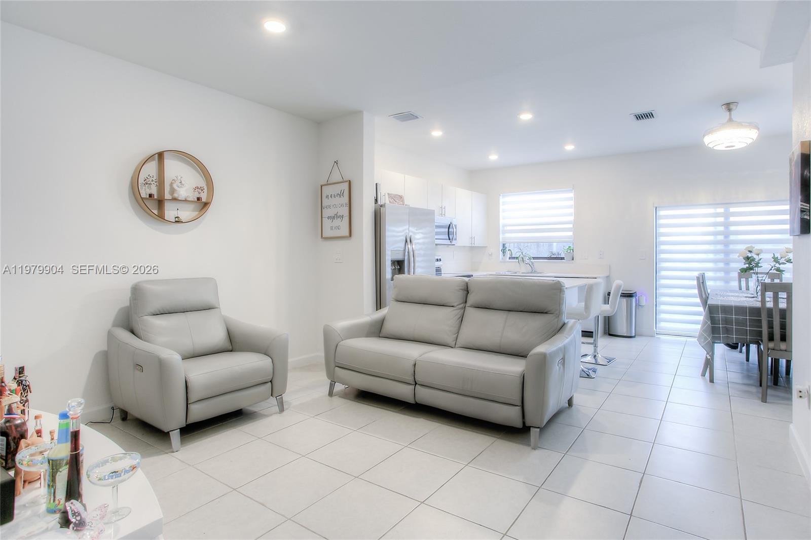 11849 Southwest 247th Terrace Homestead, FL 33032 - Photo 6 of 13 a living room with furniture and a large window