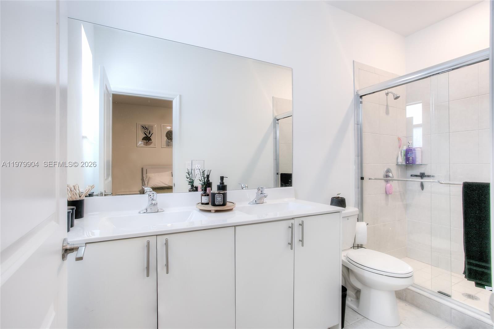 11849 Southwest 247th Terrace Homestead, FL 33032 - Photo 10 of 13 a bathroom with a sink toilet vanity and shower