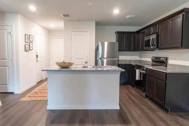a kitchen with sink and window