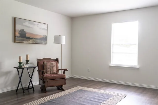 a bedroom with a bed and a mirror