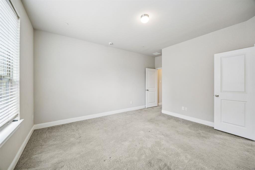 8081 Snowmass Drive Frisco, TX 75034 - Photo 11 of 25 an empty room with a natural light