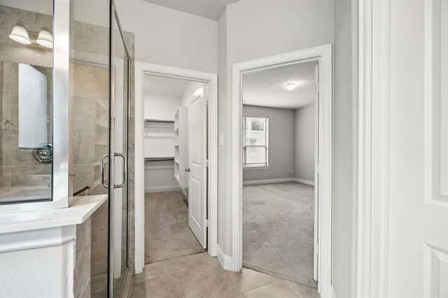 a view of a bathroom from a hallway