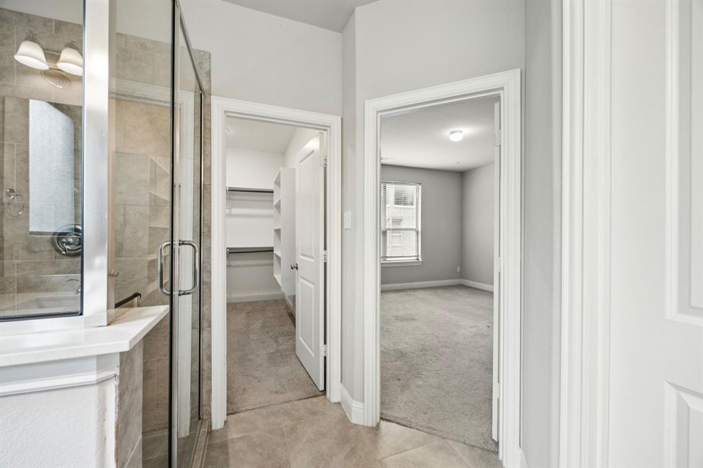 8081 Snowmass Drive Frisco, TX 75034 - Photo 14 of 25 a view of a bathroom from a hallway