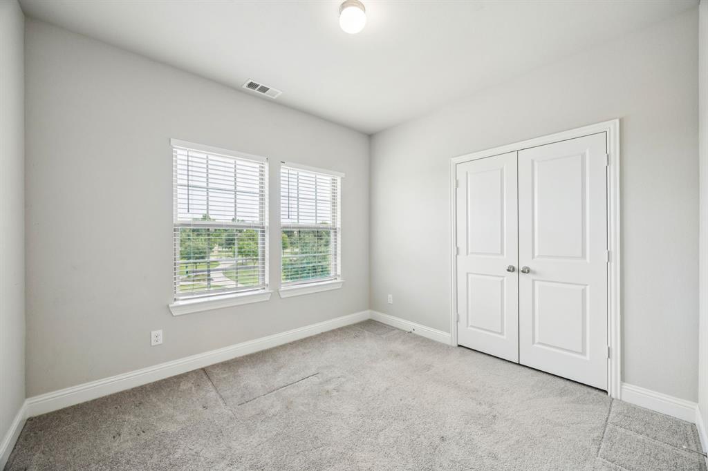 8081 Snowmass Drive Frisco, TX 75034 - Photo 16 of 25 an empty room with windows and closet