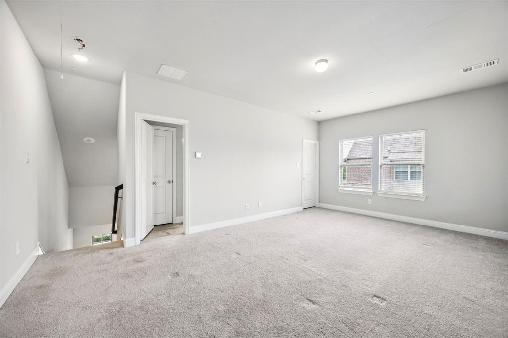 8081 Snowmass Drive Frisco, TX 75034 - Photo 20 of 25 an empty room with windows and closet