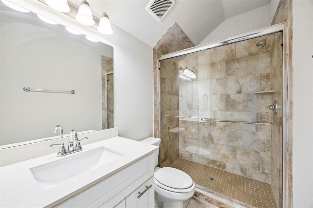 8081 Snowmass Drive Frisco, TX 75034 - Photo 21 of 25 a bathroom with a sink a toilet and shower