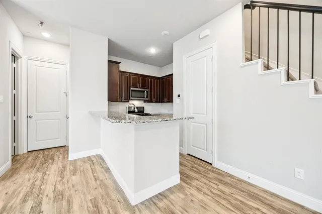 a view of kitchen and wooden floor