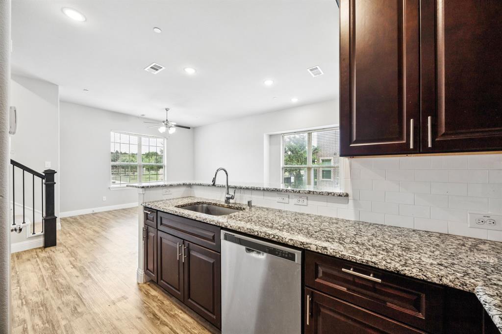 8081 Snowmass Drive Frisco, TX 75034 - Photo 8 of 25 a kitchen with a sink stove and cabinets