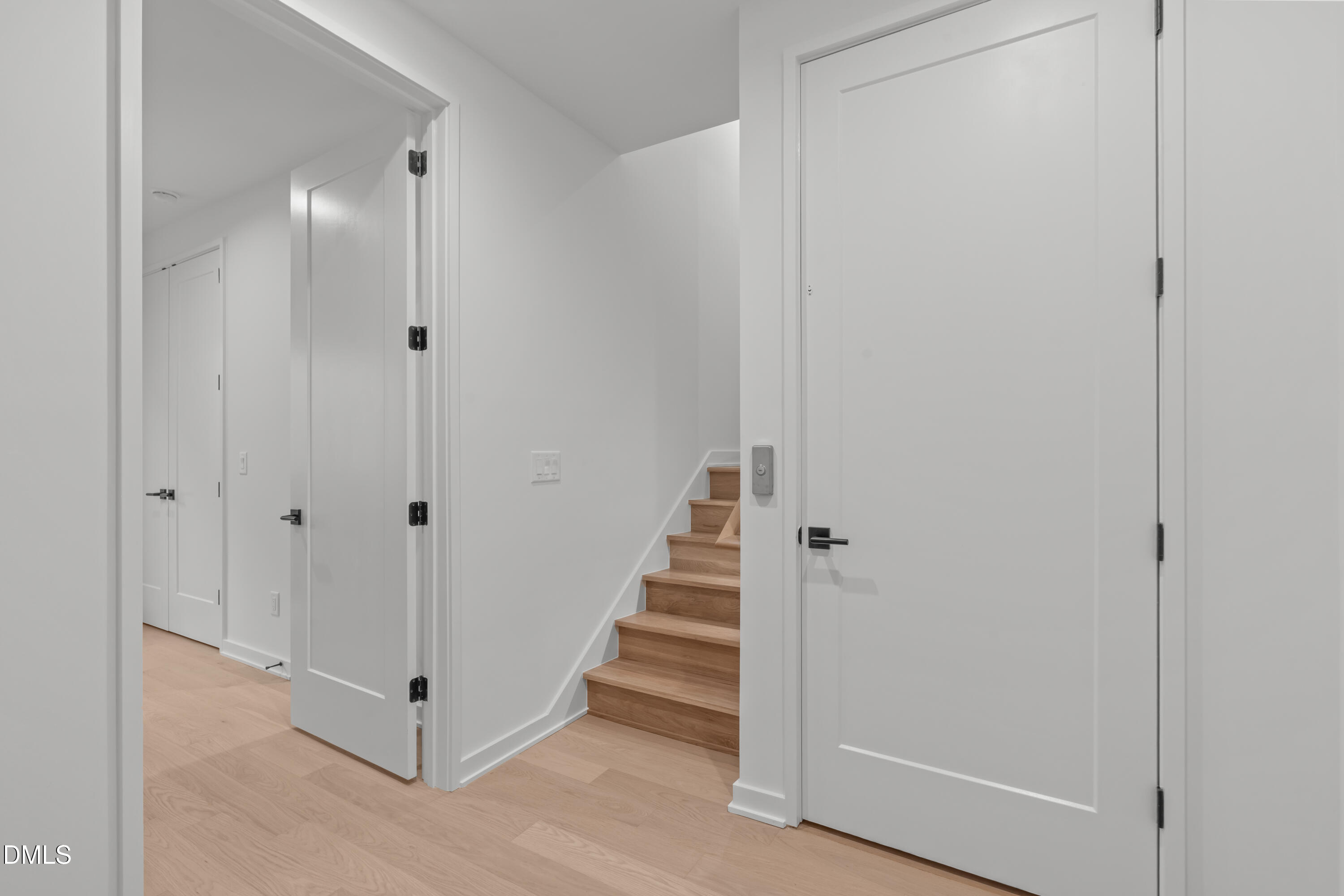1307 Chamblee Hl Court Raleigh, NC 27608 - Photo 37 of 65 a view of a hallway with staircase