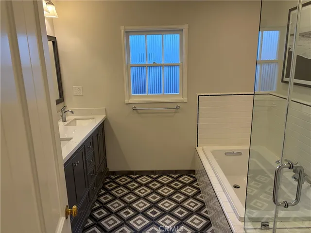 a bathroom with a sink and a shower
