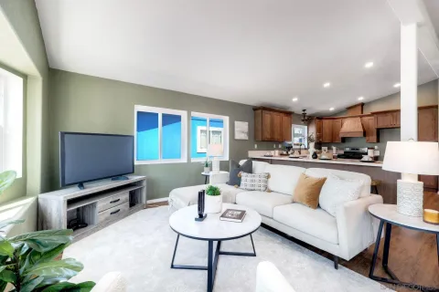 a living room with furniture and a flat screen tv