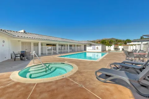 a view of a swimming pool with a patio