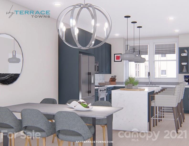 2335 Wesley Village Road, Unit 35 Charlotte, NC 28208 - Photo 11 of 28 a kitchen with a table and chairs in it