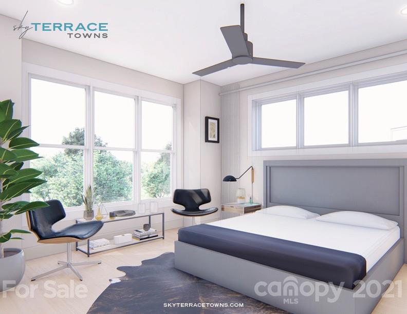 2335 Wesley Village Road, Unit 35 Charlotte, NC 28208 - Photo 12 of 28 a bedroom with a large bed and a window