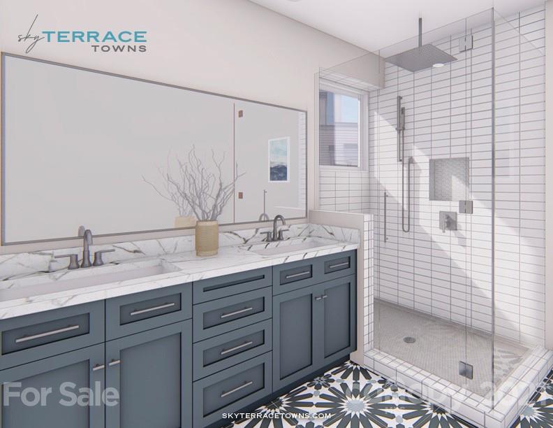 2335 Wesley Village Road, Unit 35 Charlotte, NC 28208 - Photo 13 of 28 a bathroom with a shower sink and mirror