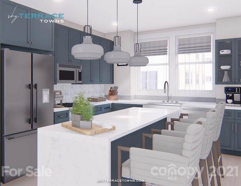 2335 Wesley Village Road, Unit 35 Charlotte, NC 28208 - Photo 14 of 28 a kitchen with stainless steel appliances a table and chairs