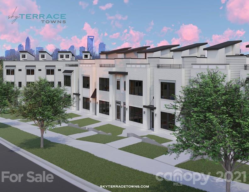 2335 Wesley Village Road, Unit 35 Charlotte, NC 28208 - Photo 19 of 28 a view of a white building with a yard