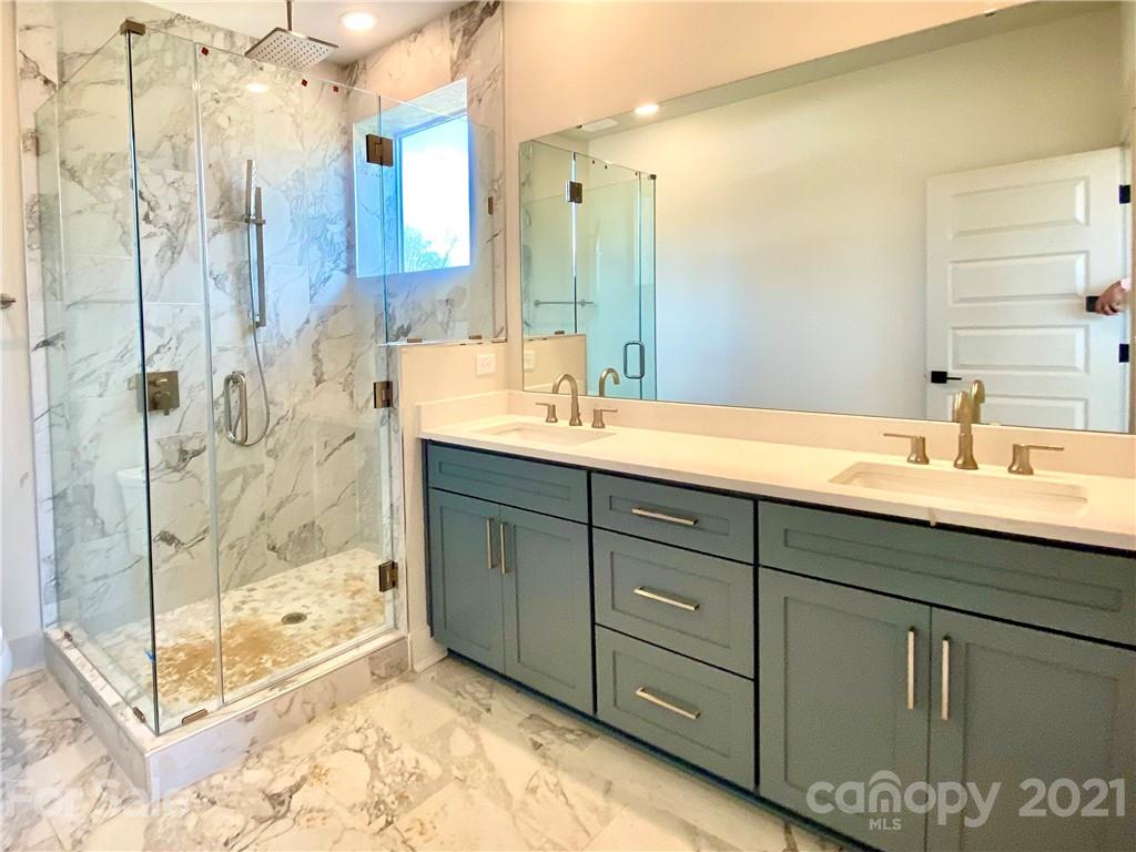 2335 Wesley Village Road, Unit 35 Charlotte, NC 28208 - Photo 23 of 28 a bathroom with a sink and a mirror