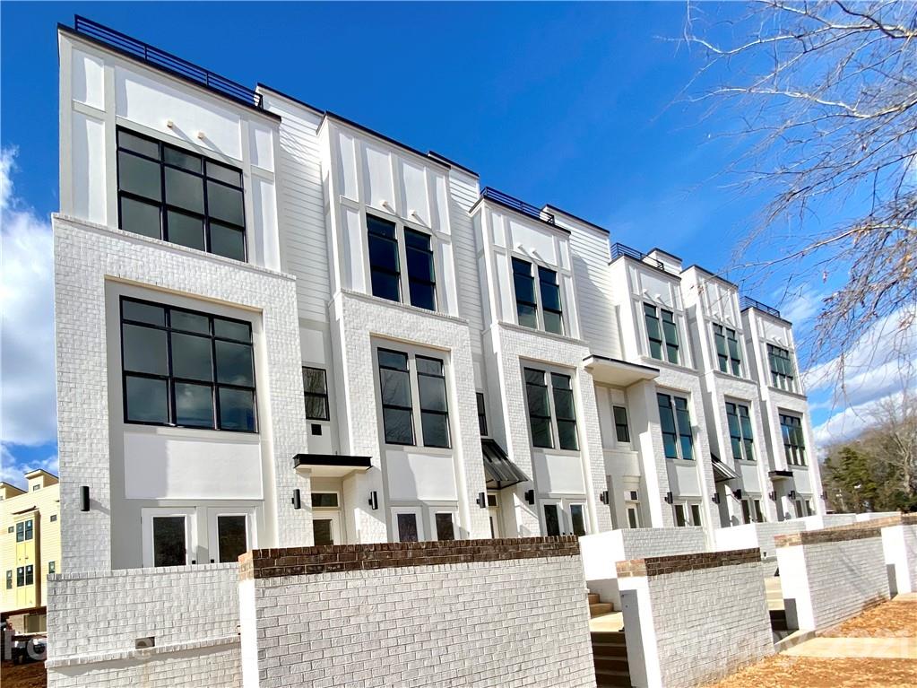 2335 Wesley Village Road, Unit 35 Charlotte, NC 28208 - Photo 28 of 28 a front view of a building with a street