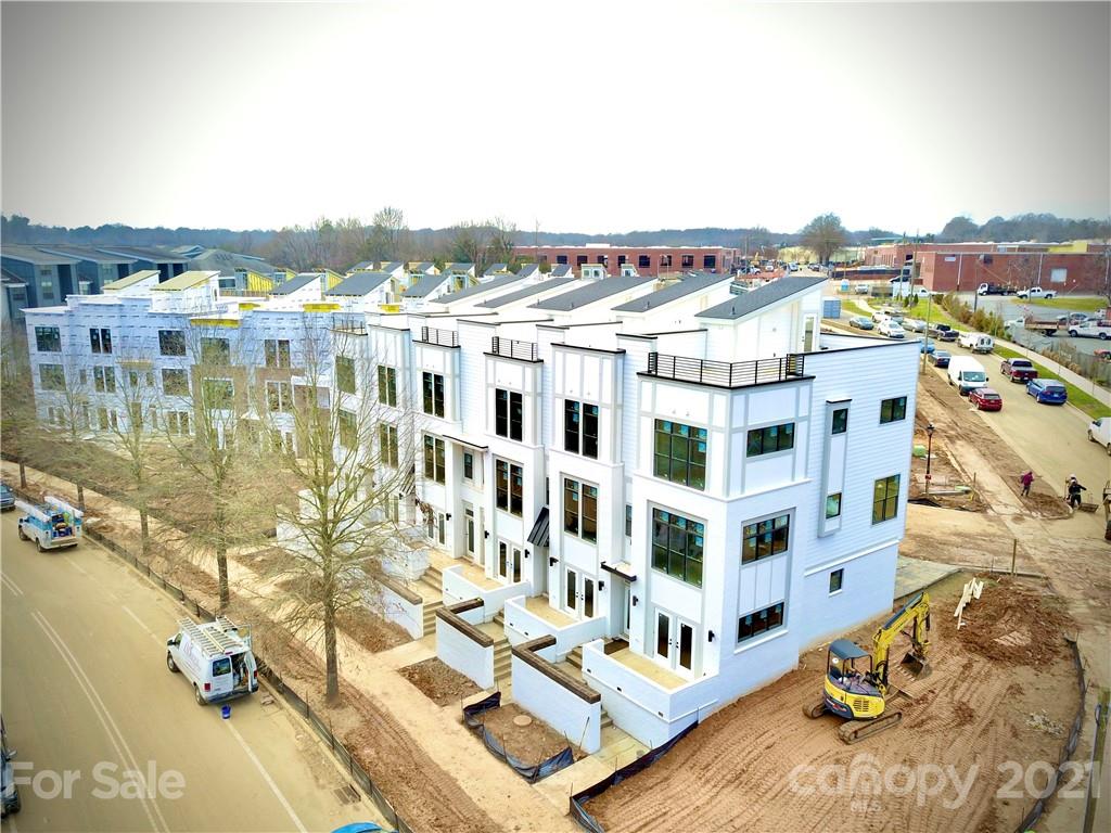 2335 Wesley Village Road, Unit 35 Charlotte, NC 28208 - Photo 6 of 28 a view of a large building with a lake view
