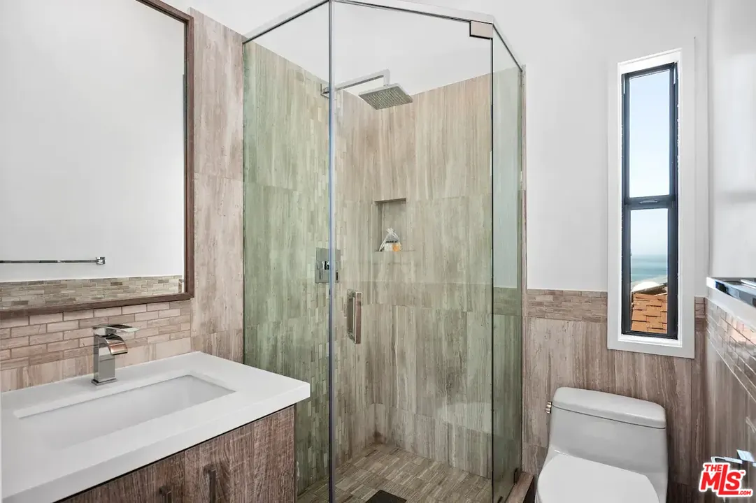24608 Malibu Road Malibu, CA 90265 - Photo 23 of 30 a bathroom with a sink a toilet and shower