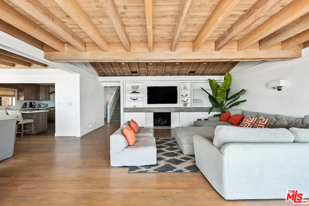 24608 Malibu Road Malibu, CA 90265 - Photo 30 of 30 a living room with furniture and a flat screen tv