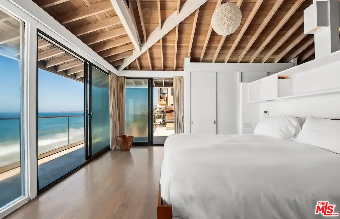 24608 Malibu Road Malibu, CA 90265 - Photo 7 of 30 a large room with a bed and wooden floor