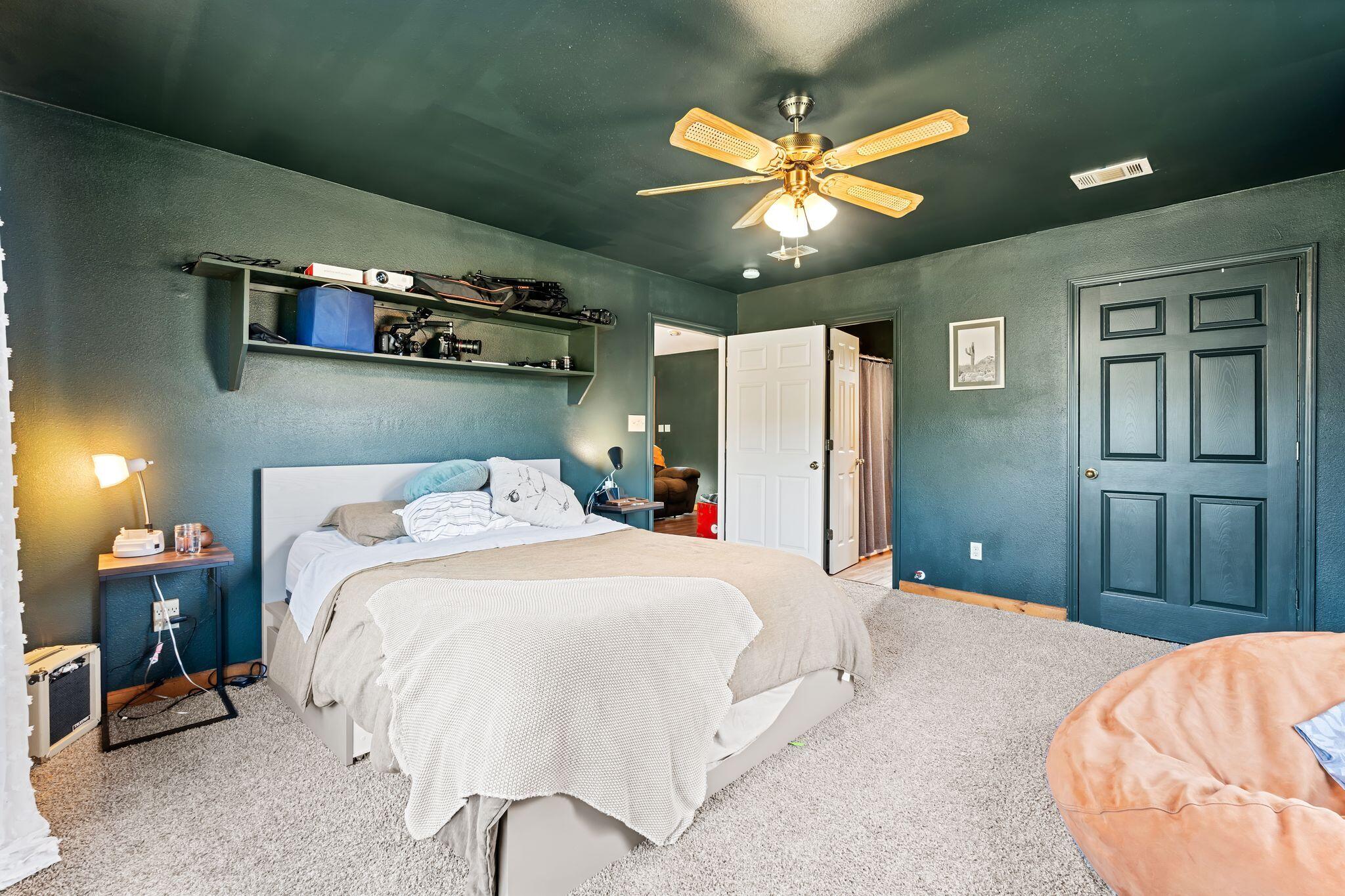 845 Williams Road DeFuniak Springs, FL 32433 - Photo 10 of 24 a bedroom with a bed and a chandelier