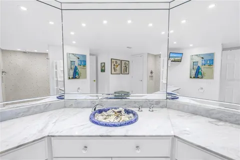 a bathroom with a bathtub and shower