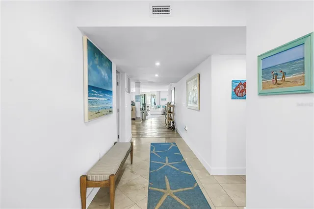a kitchen with stainless steel appliances granite countertop a sink and wooden cabinets