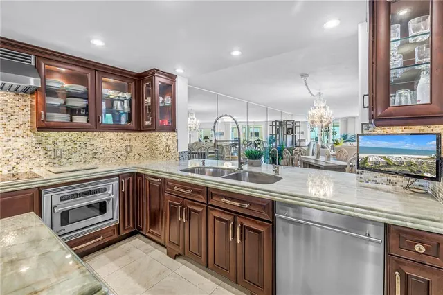 a kitchen with a table chairs and a refrigerator