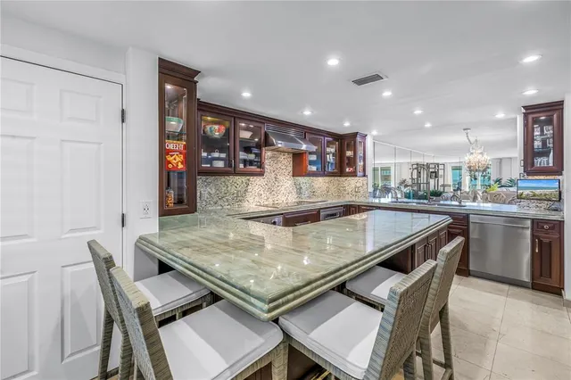 a living room with fireplace furniture and a wooden floor