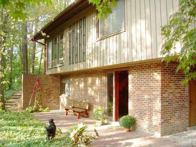 111 Longview Lake Drive Raleigh, NC 27610 - Photo 3 of 10 a building with trees in front of it