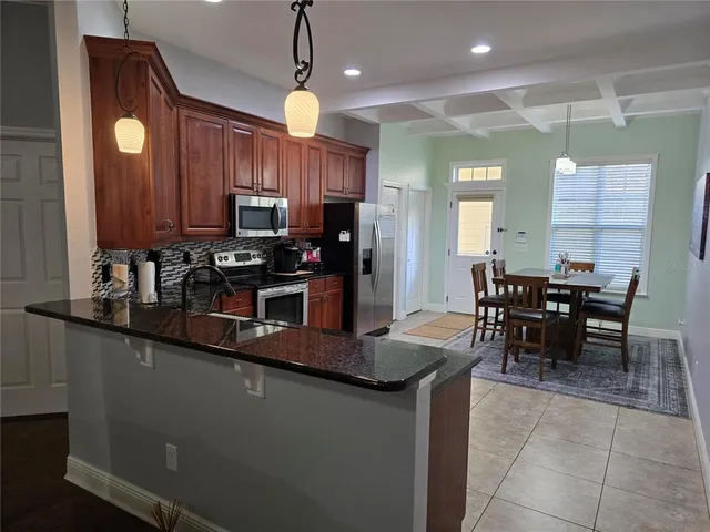 a view of a dining room with furniture