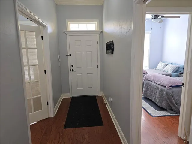a living room with furniture a ceiling fan and a rug