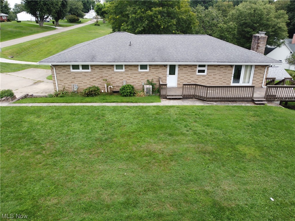 62273 Tacoma Road Barnesville, OH 43713 - Photo 4 of 34 Back of property featuring a yard and wooden deck