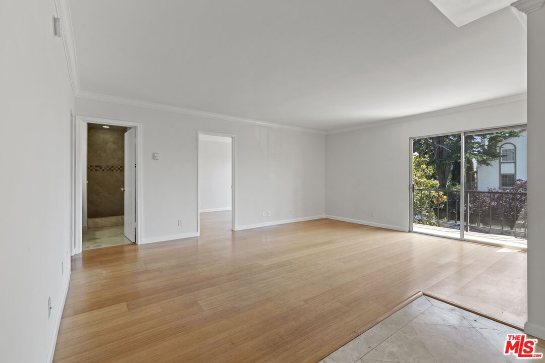 1033 6th Street, Unit 212 Santa Monica, CA 90403 - Photo 17 of 18 a view of an empty room with glass door and balcony