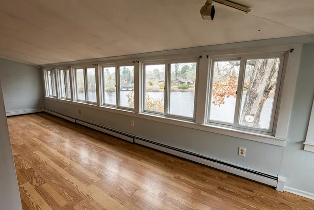 a view of an empty room with windows