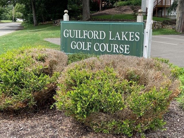 24 Echo Point Road Guilford, CT 06437 - Photo 26 of 30 a sign broad in front of red brick house