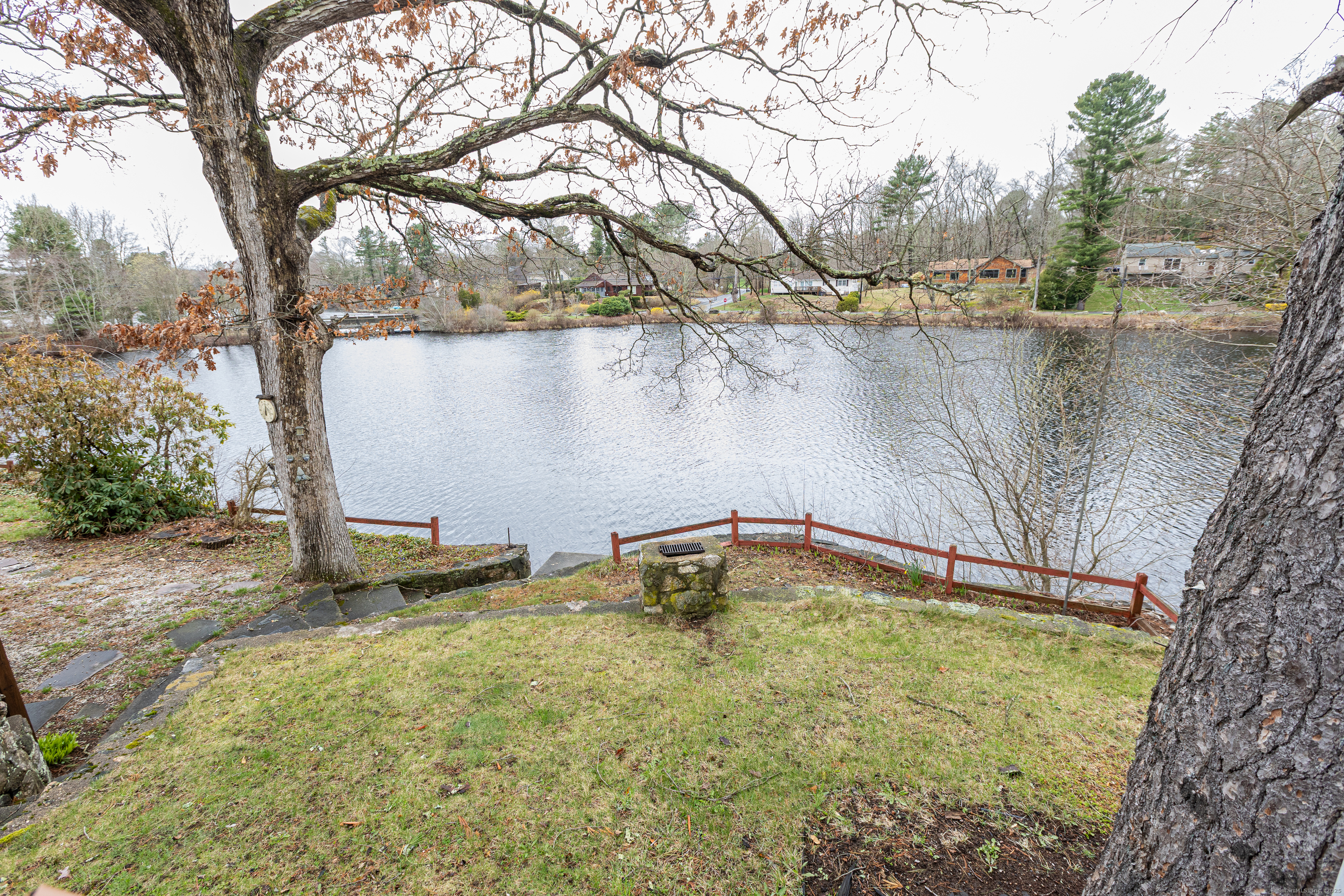 24 Echo Point Road Guilford, CT 06437 - Photo 8 of 30 a swimming pool with trees in the background
