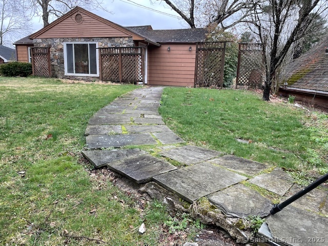 24 Echo Point Road Guilford, CT 06437 - Photo 10 of 30 a front view of a house with a garden and yard