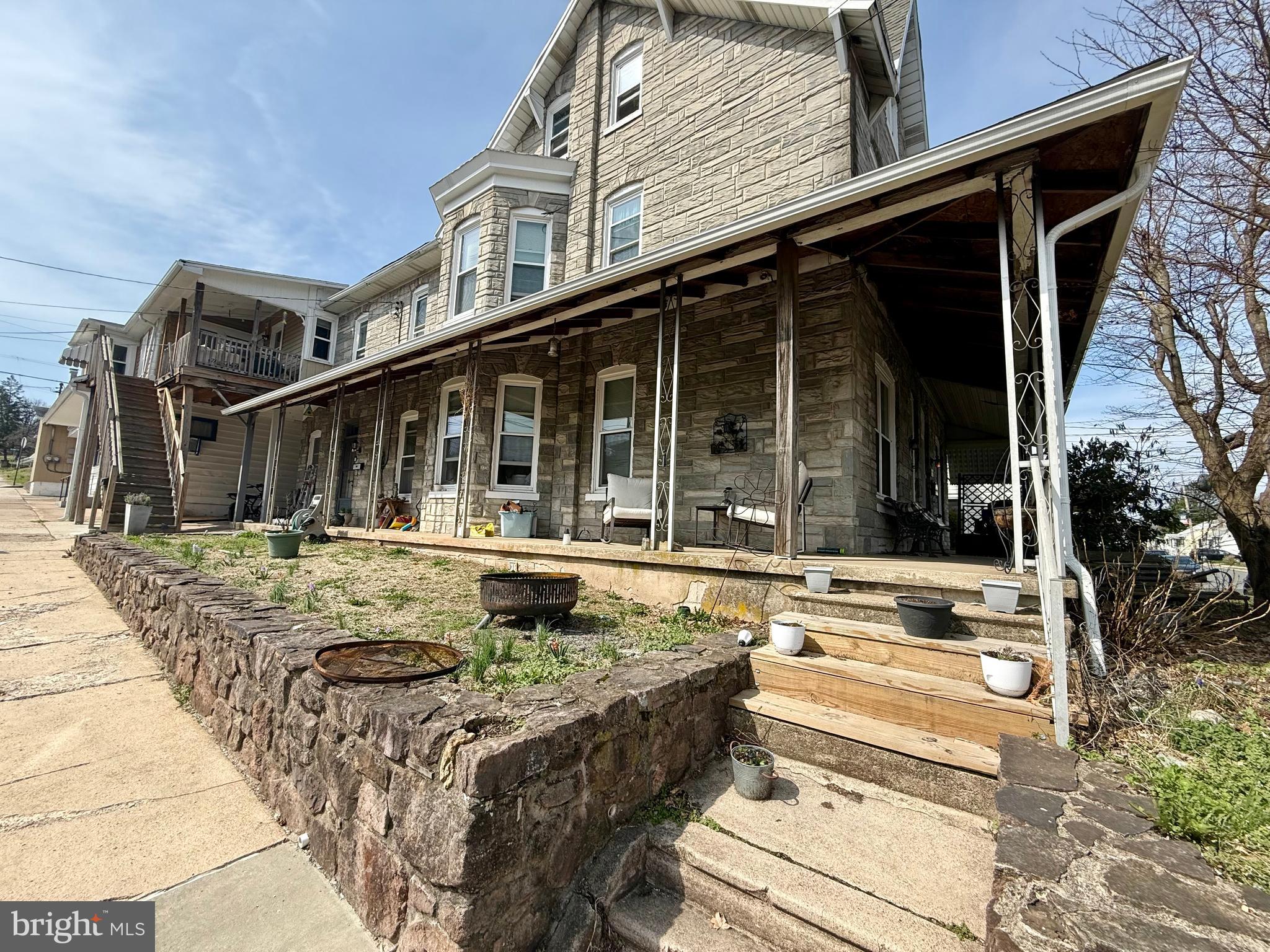 402 West 1st Street Birdsboro, PA 19508 - Photo 2 of 18 a view of a house with a swimming pool and a porch with furniture