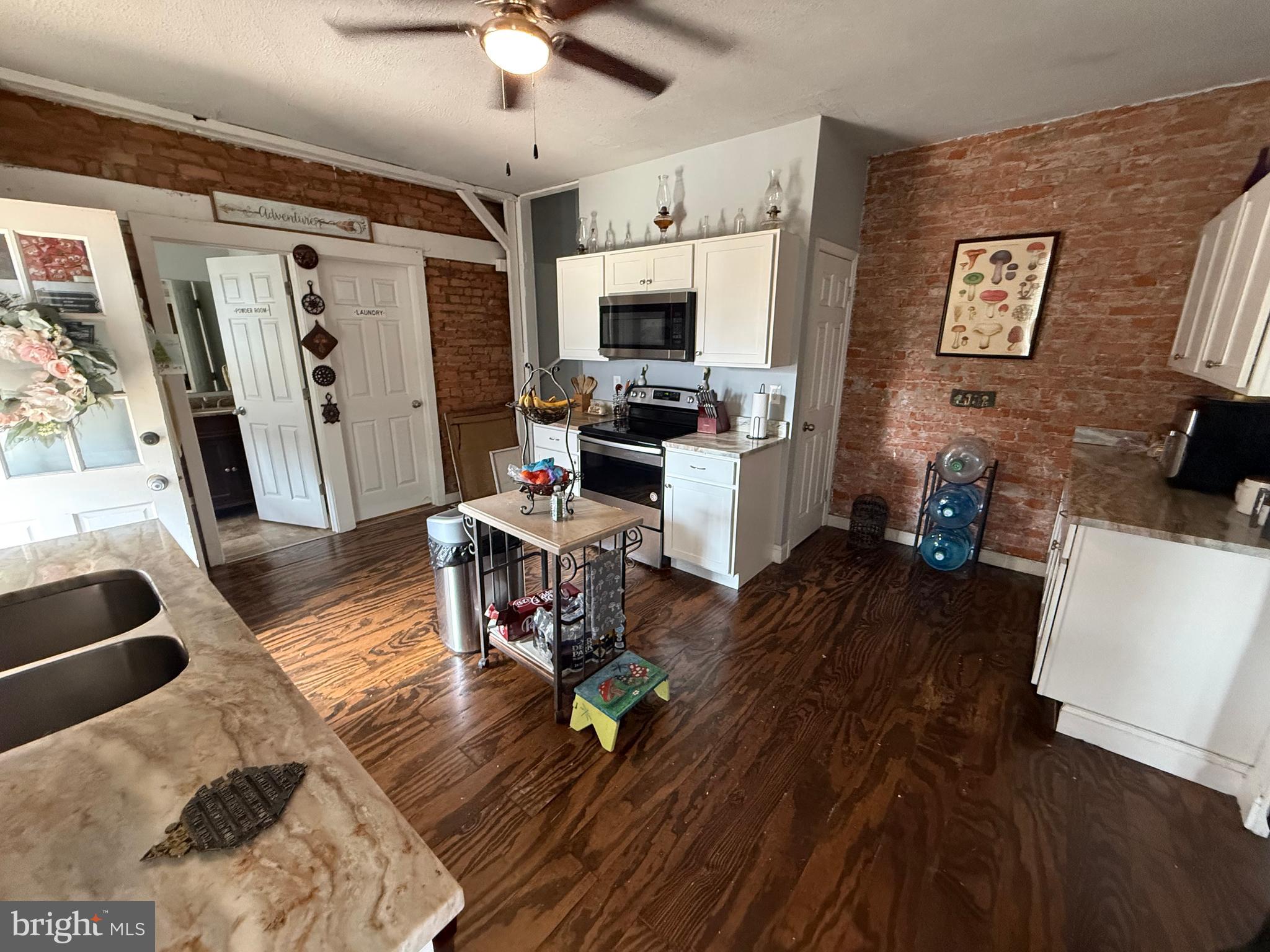 402 West 1st Street Birdsboro, PA 19508 - Photo 7 of 18 a living room with furniture and a flat screen tv