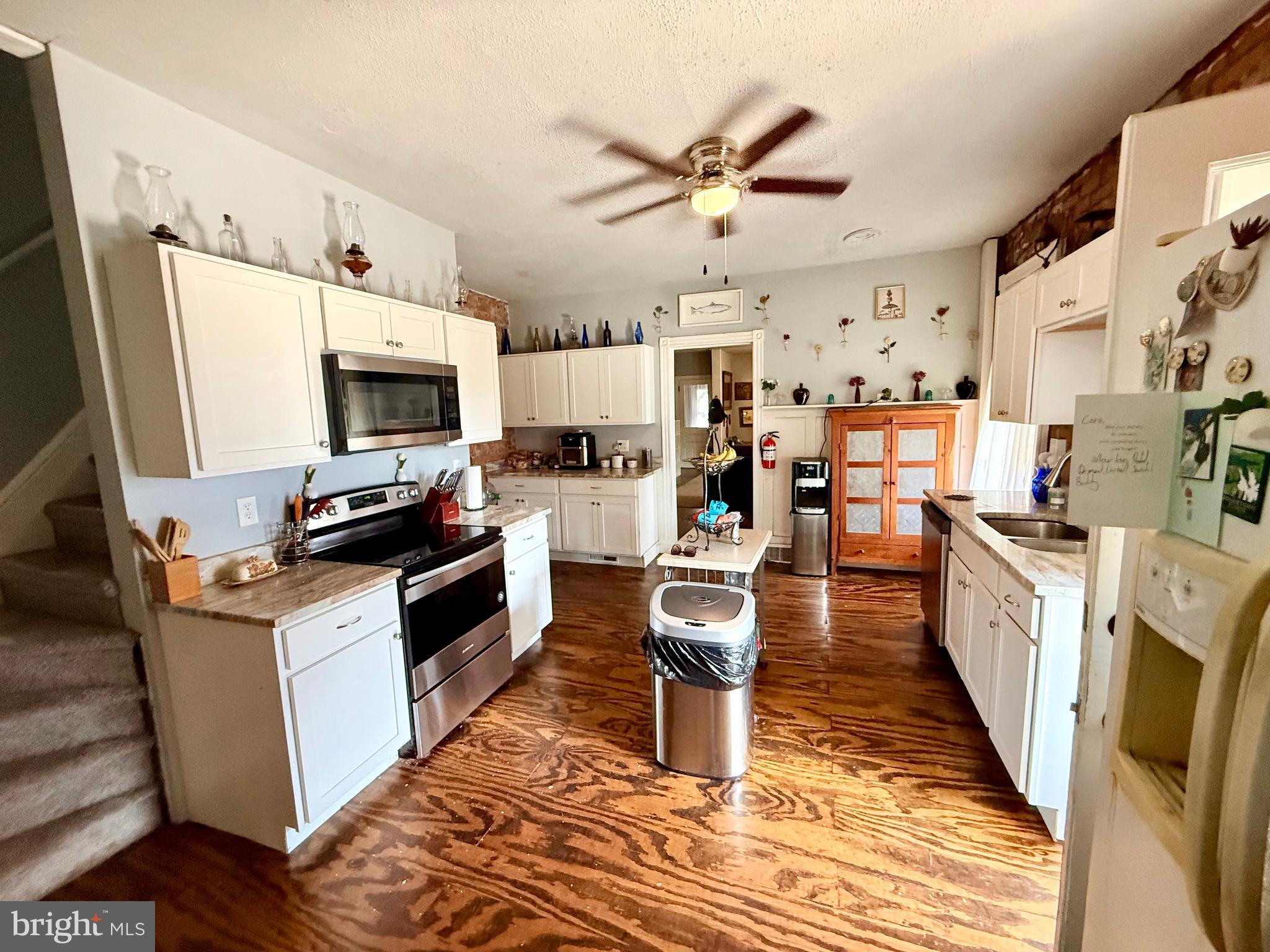 402 West 1st Street Birdsboro, PA 19508 - Photo 8 of 18 a kitchen with stainless steel appliances a stove top oven a sink dishwasher and a refrigerator