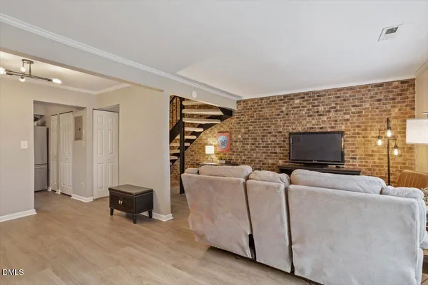 a living room with furniture and a lamp